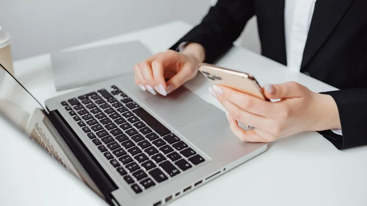 Applying for same day loans online with a laptop and phone in Canada