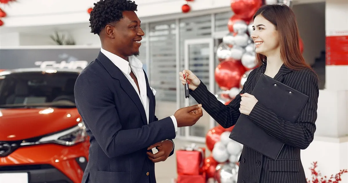 Customer getting an auto loan at a dealership in Canada
