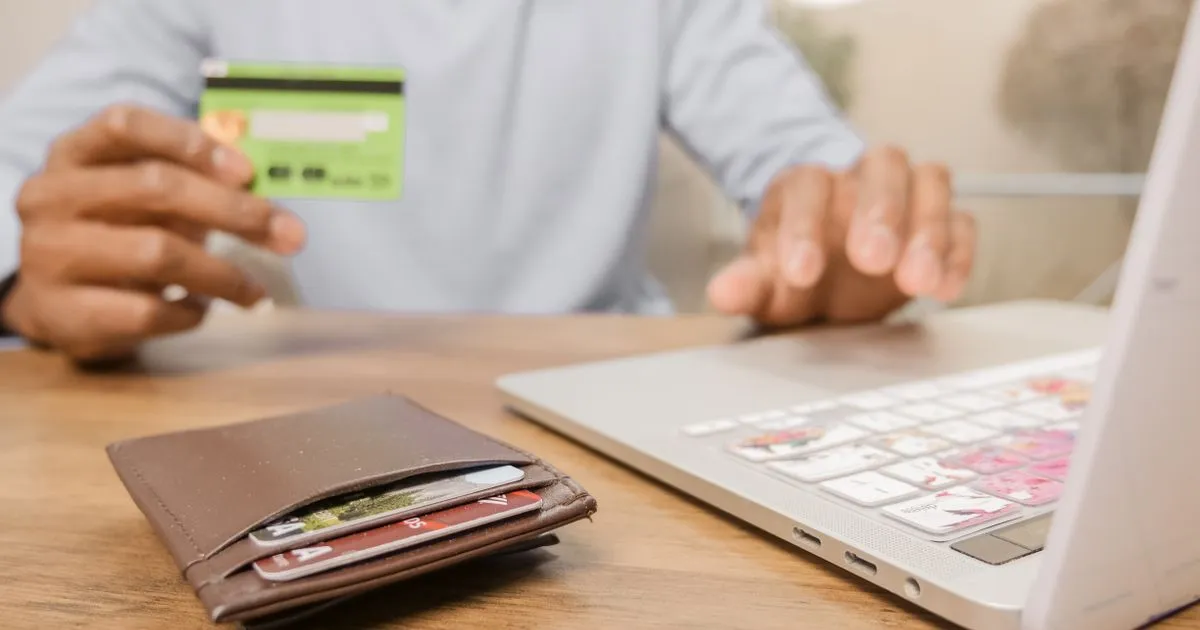 Online banking in Canada with a bank card and laptop