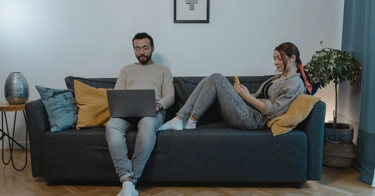 Burnaby residents comparing personal loans online on a laptop and phone