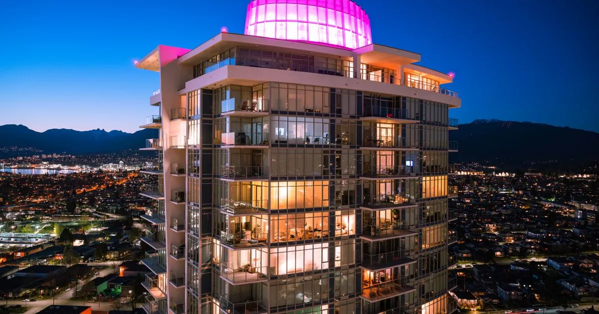 Borrowing across Burnaby - illuminated Burnaby high-rise at twilight