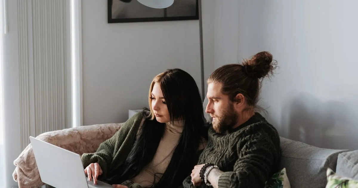 Kelowna residents comparing personal loans online on a laptop and phone