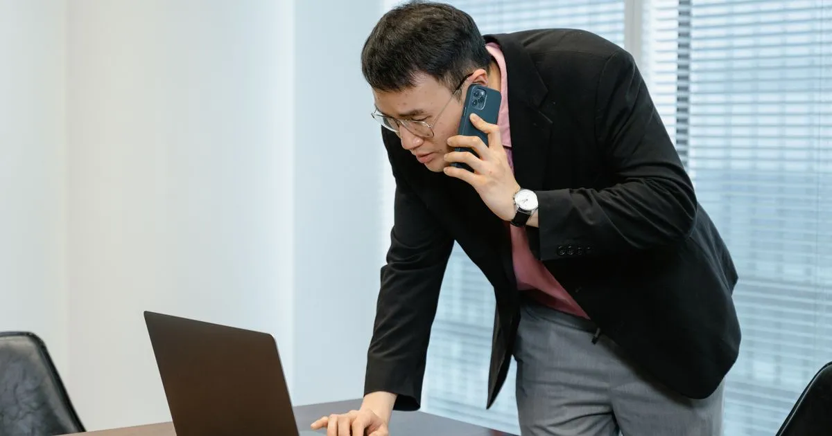 Kitchener residents comparing personal loans online on a laptop and phone