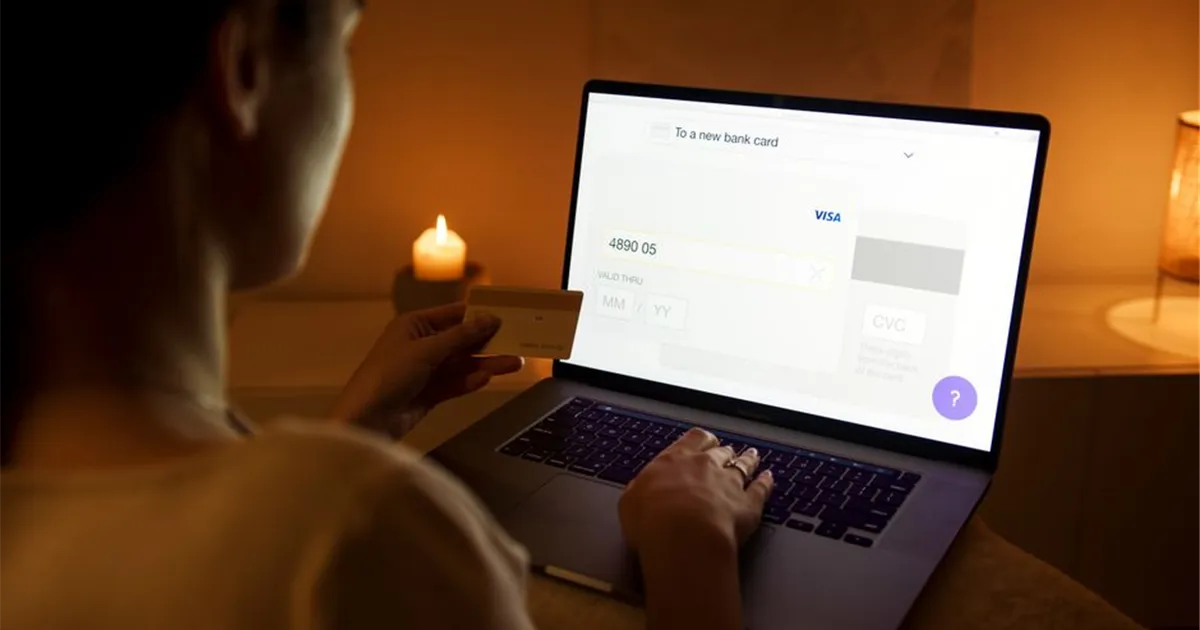 Manitobans comparing personal loans online on a laptop and phone