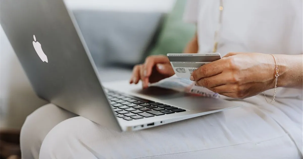 Nova Scotians comparing personal loans online on a laptop and phone