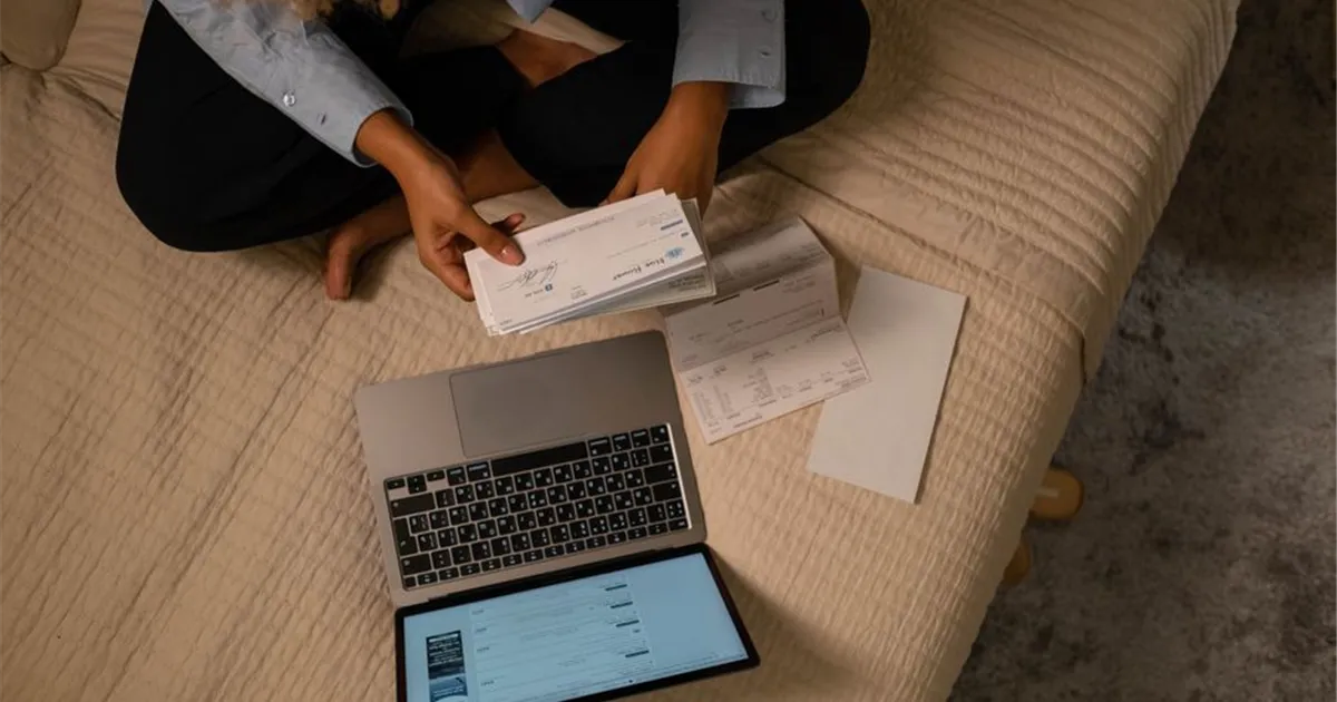 Ontarians comparing personal loans online on a laptop and phone