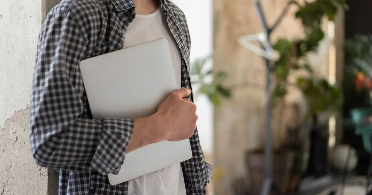 Red Deer residents comparing personal loans online on a laptop and phone