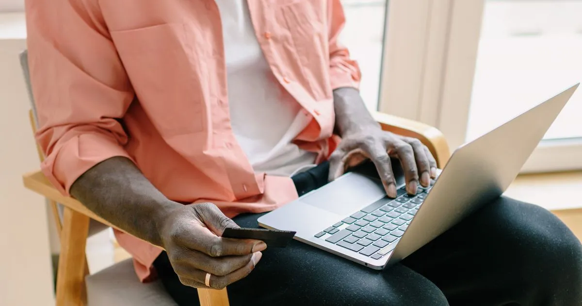 Surrey residents comparing personal loans online on a laptop and phone