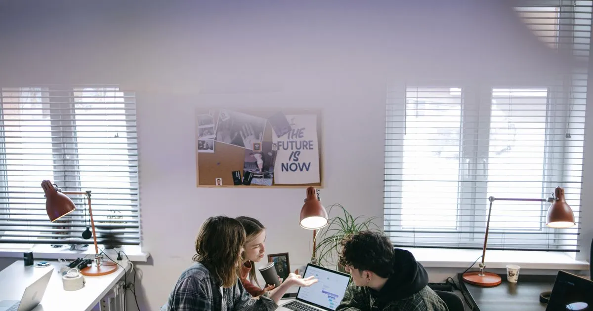 Vancouverites comparing personal loans online on a laptop and phone