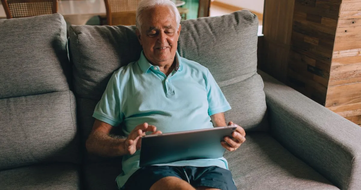 Windsor residents comparing personal loans online on a laptop and phone