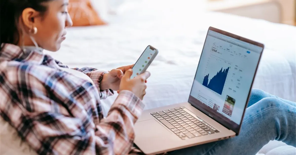 Yukoners comparing personal loans online on a laptop and phone