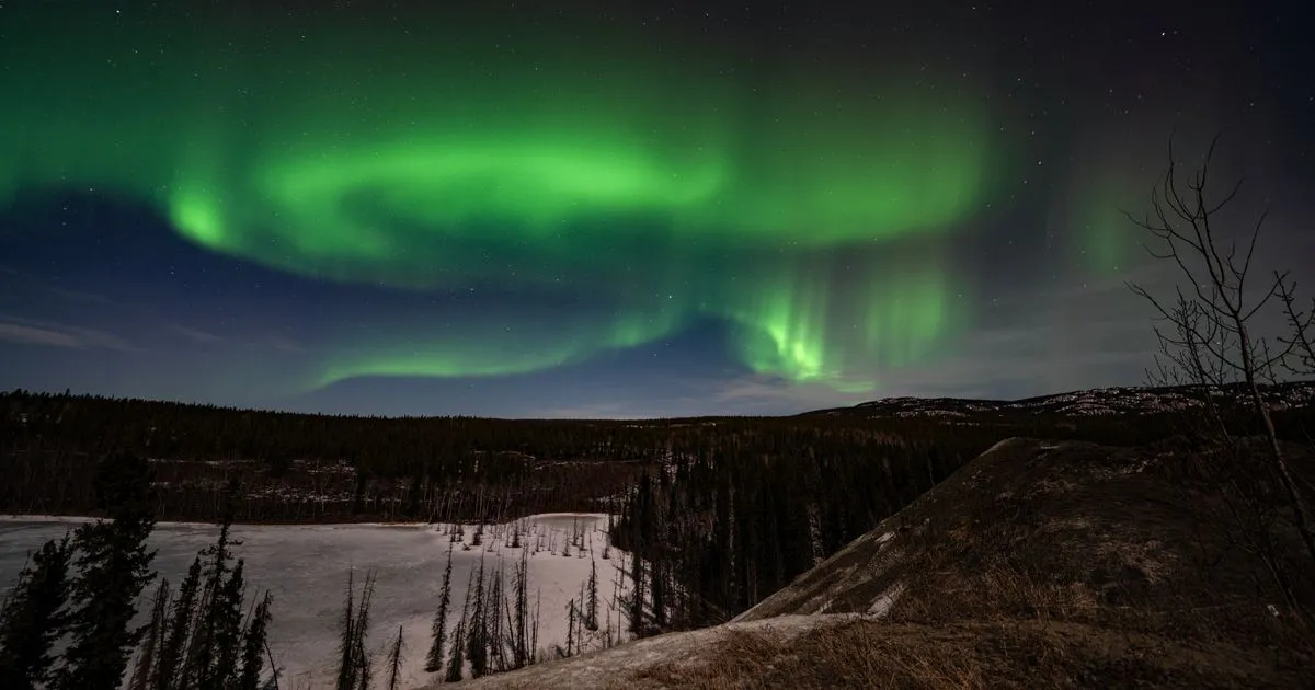 Borrowing in Yukon - aurora borealis over Whitehorse