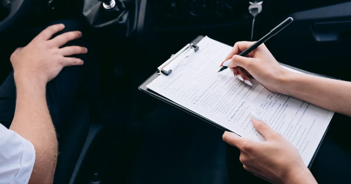 Signing car title loan paperwork inside a vehicle in Canada