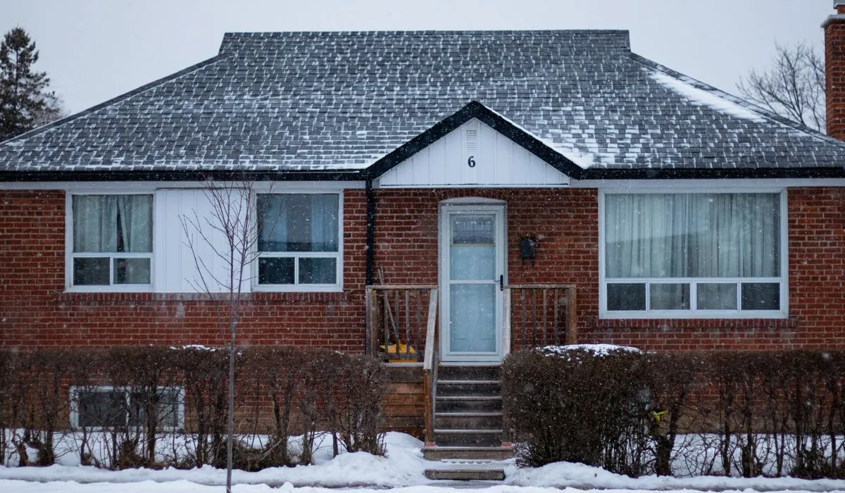Canadian brick home representing CMHC fees on a high-ratio mortgage