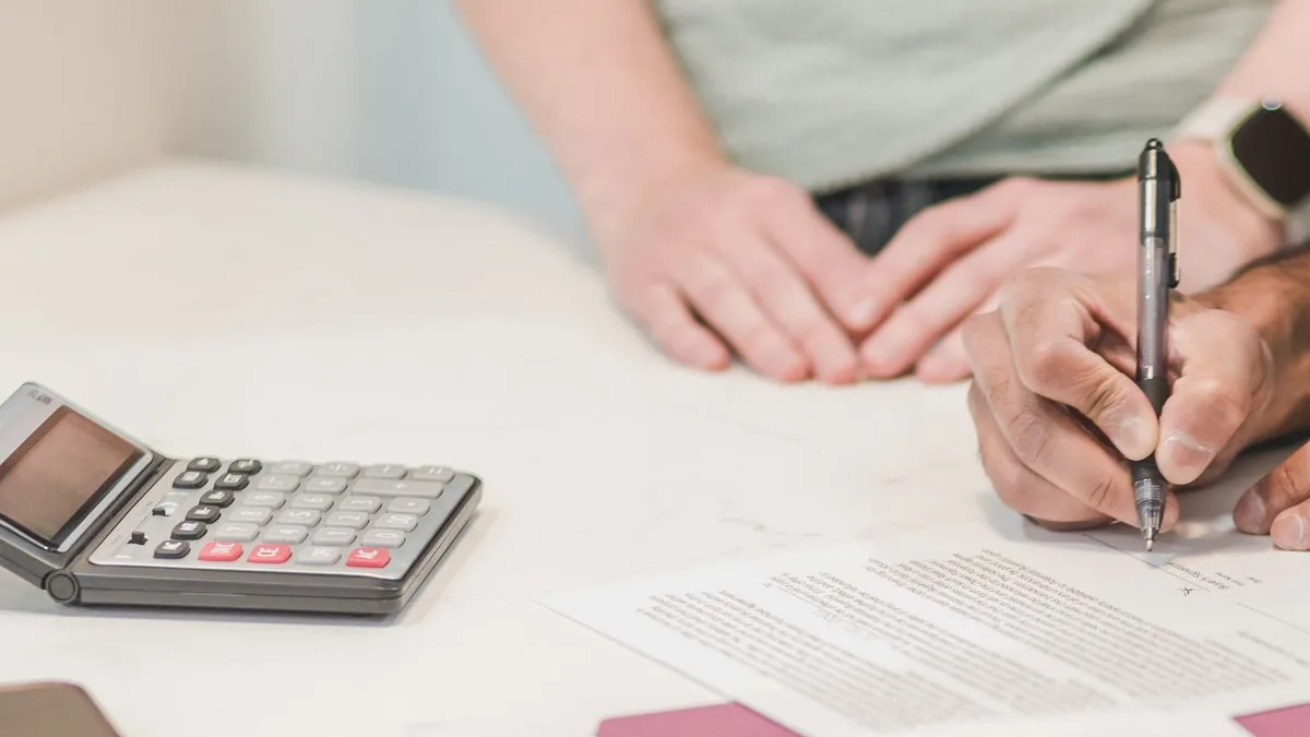 Couple signing a loan agreement for a common loan option