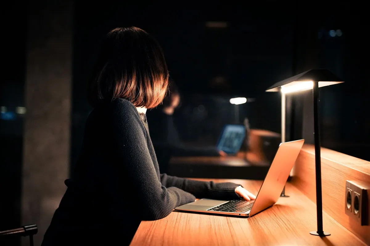 Woman planning her savings and high-interest savings accounts on a laptop
