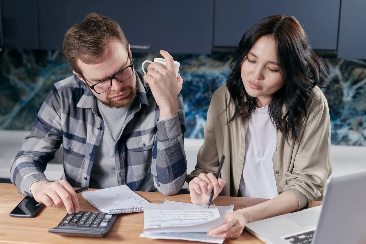 Homeowners reviewing finances before getting a home equity line of credit