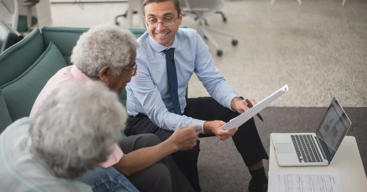 Insurance advisor comparing coverage with clients in Canada