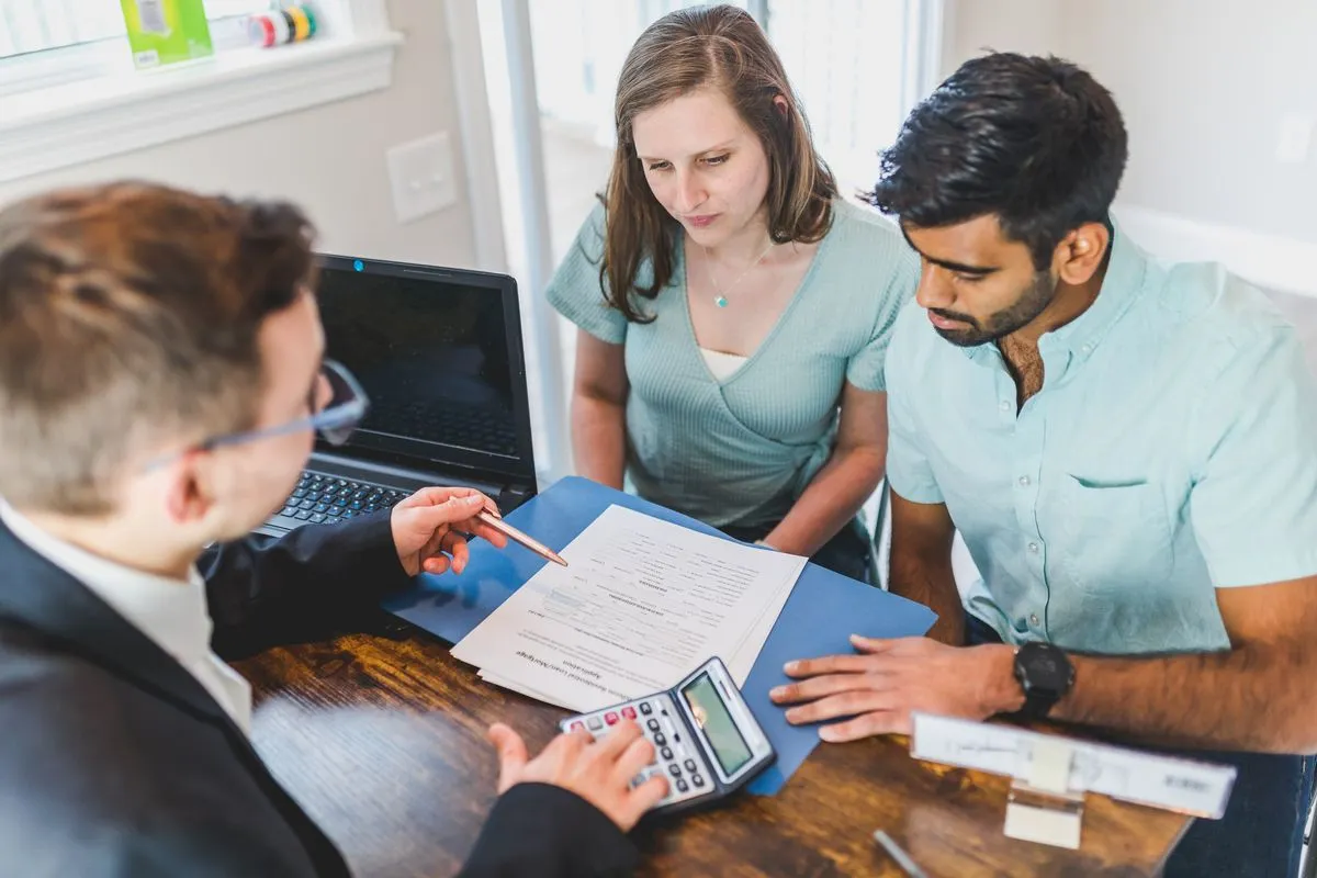 Couple reviewing joint mortgage affordability with a broker