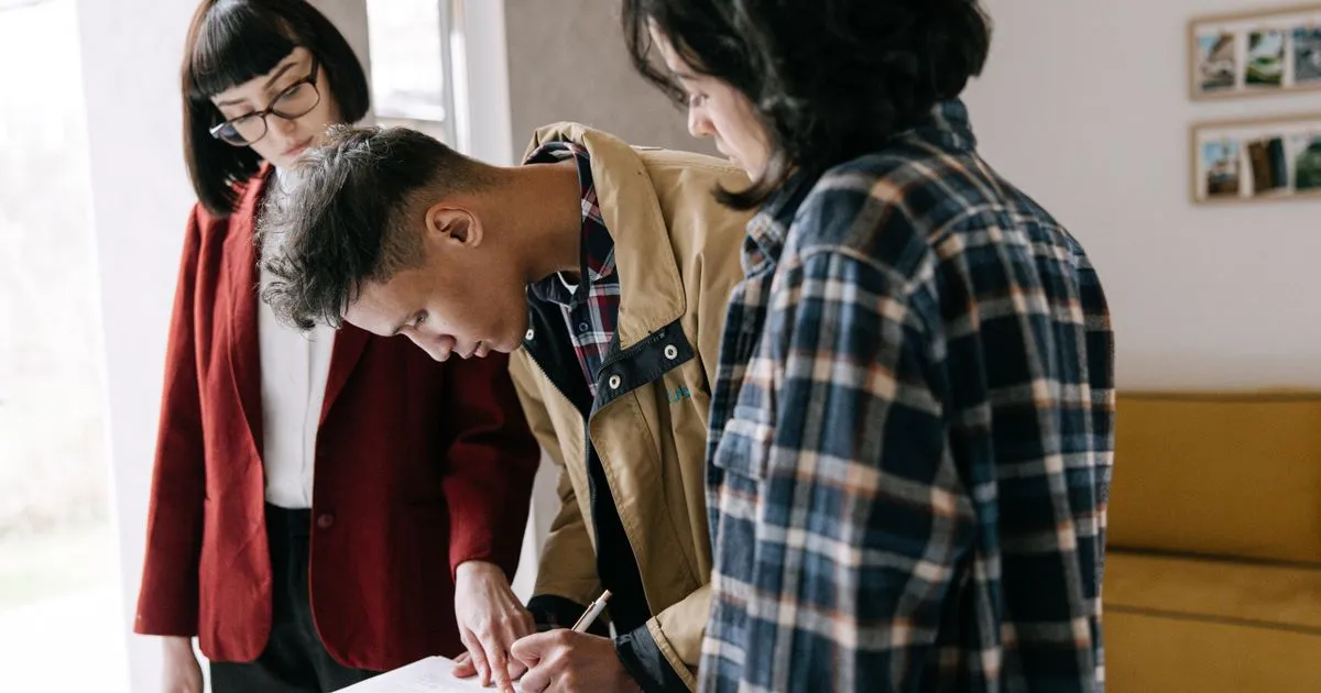 Couple signing a joint mortgage agreement in Canada