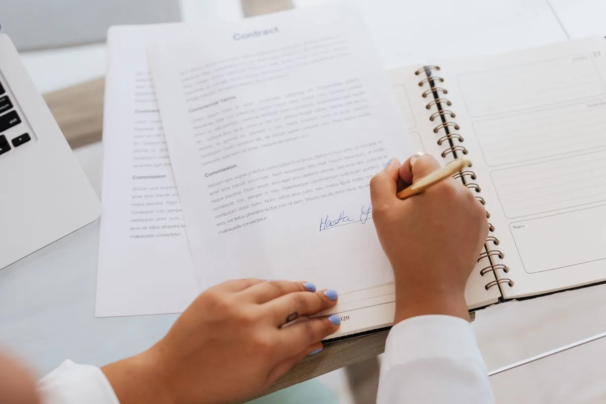 Signing mortgage documents and a purchase contract in Canada