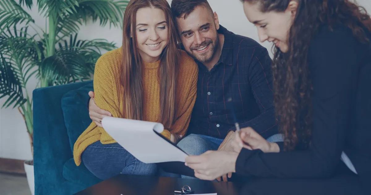 Couple reviewing mortgage refinancing documents in Canada