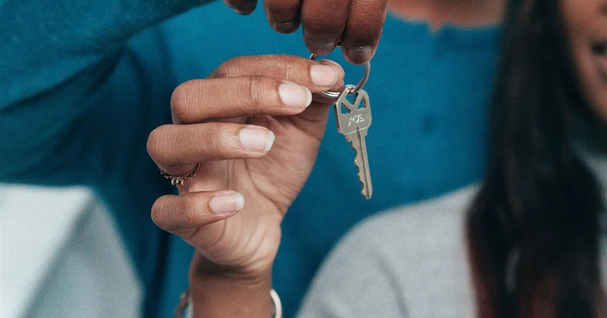 Couple holding keys after mortgage approval in Canada