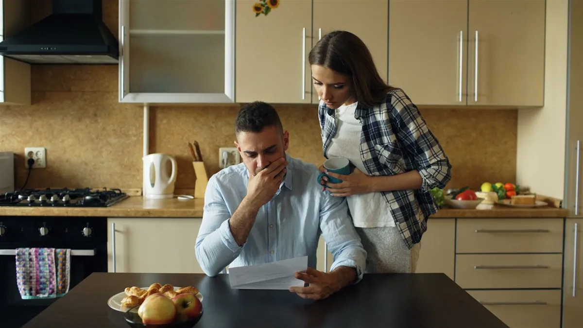 Ontario couple reviewing a bill before applying for payday loans