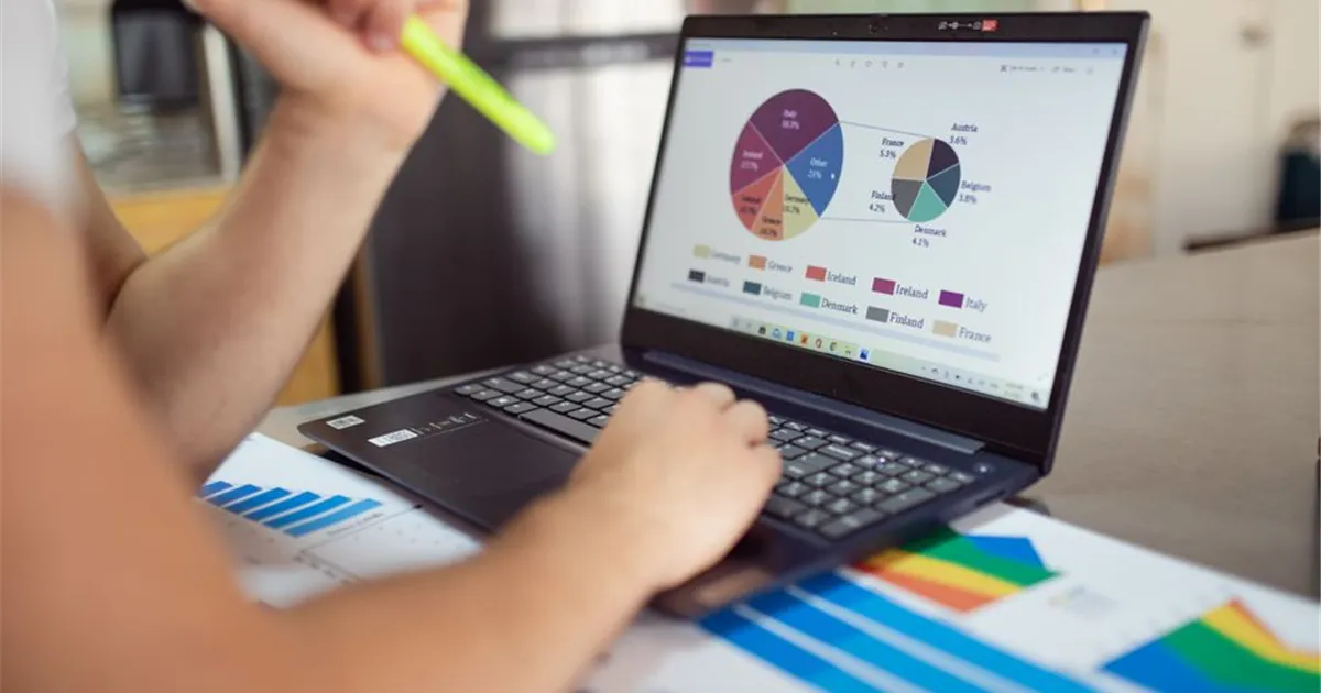 Reviewing personal loan rates and repayment plan on a laptop