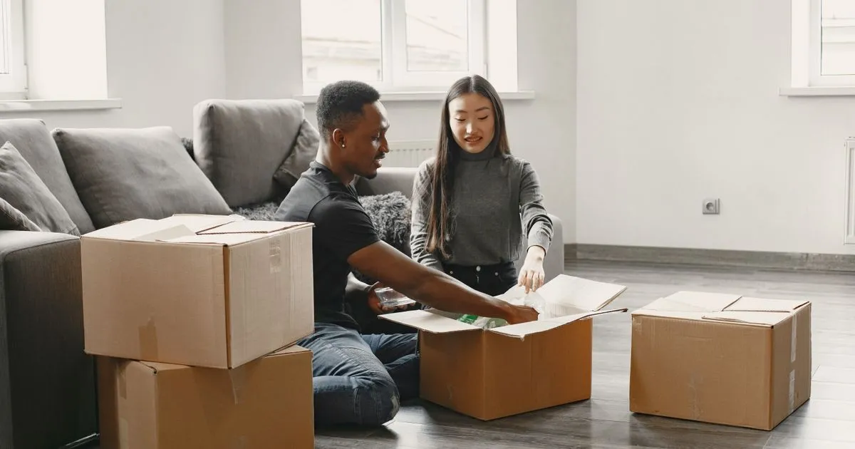 Couple moving into a new home after porting a mortgage in Canada