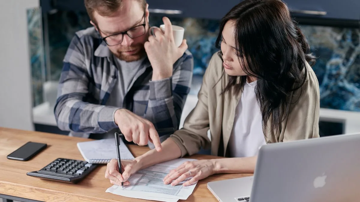 Couple reviewing finances to qualify for second chance loans in Canada