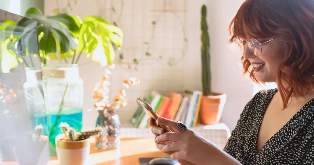 Woman applying for same day loans on her phone at home in Canada