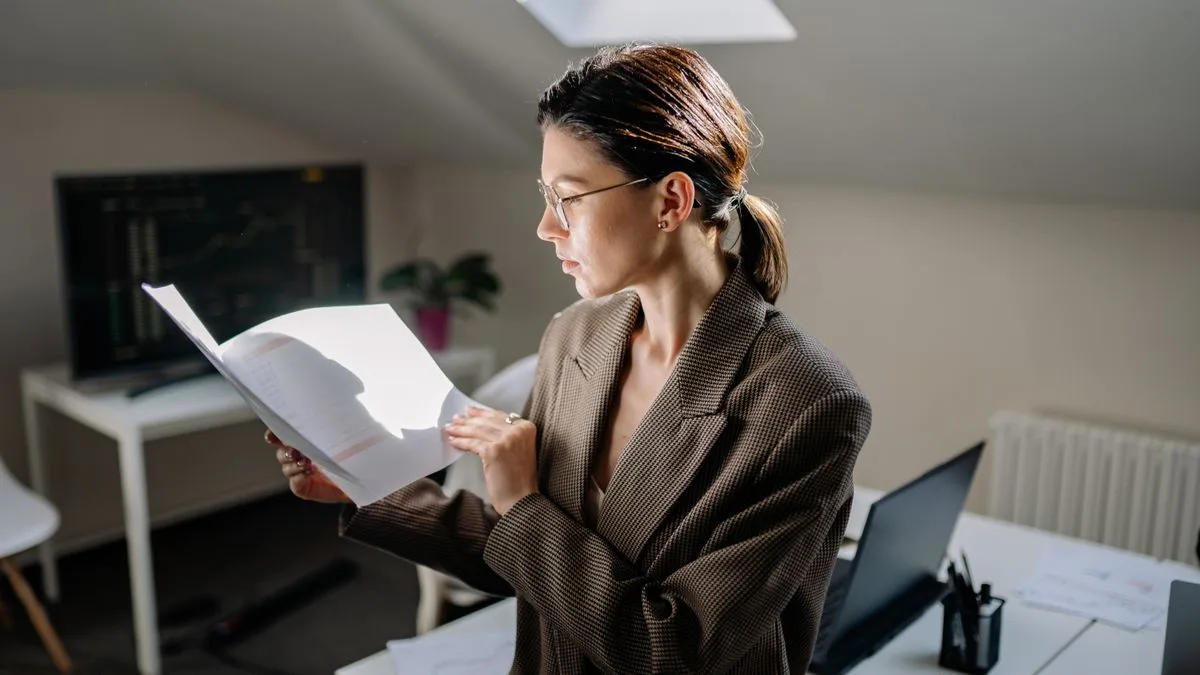 Woman reviewing simple personal loans interest rates and terms