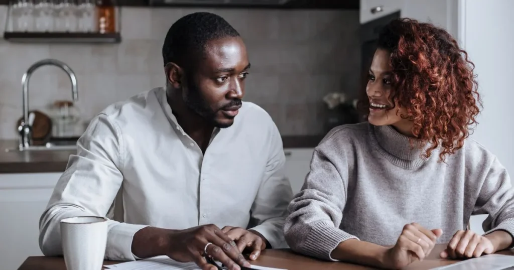 Canadian couple comparing simple personal loans at their kitchen table