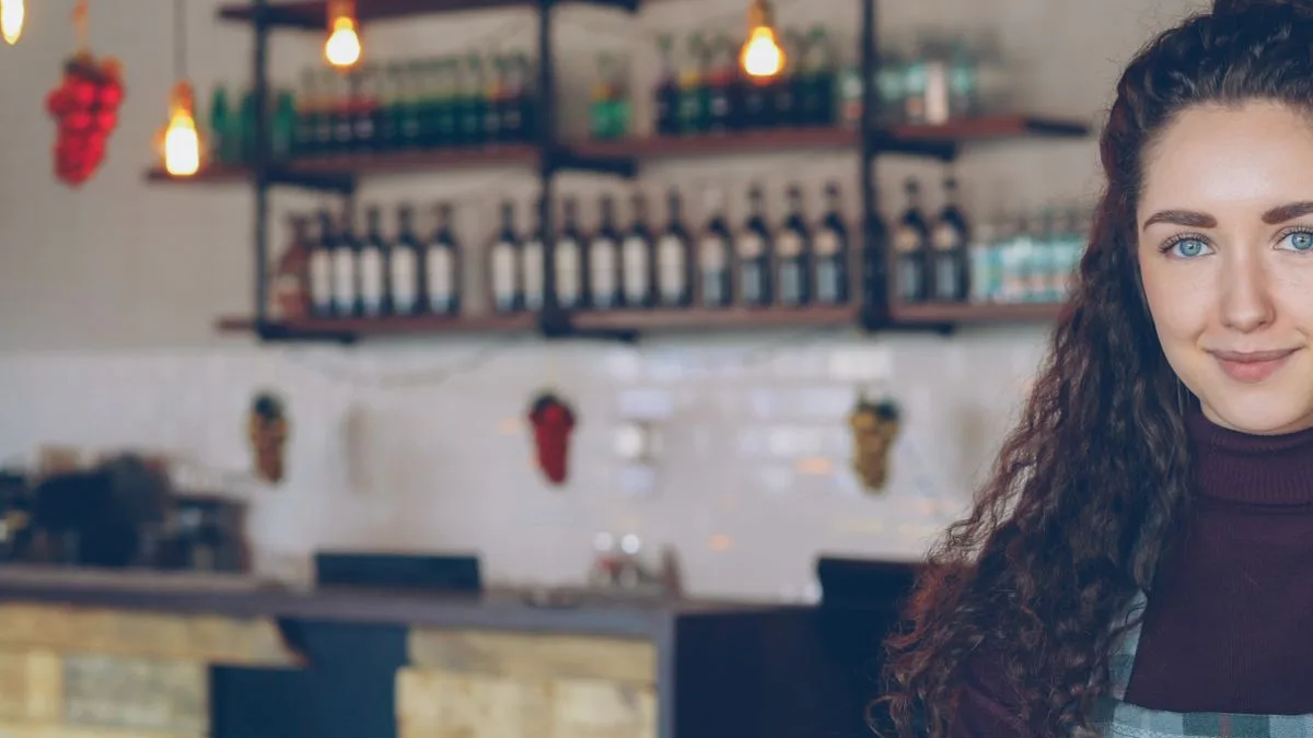 Cafe owner considering the different types of microloans