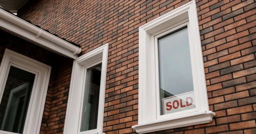 Sold sign in a Canadian home window after a variable vs fixed mortgage decision