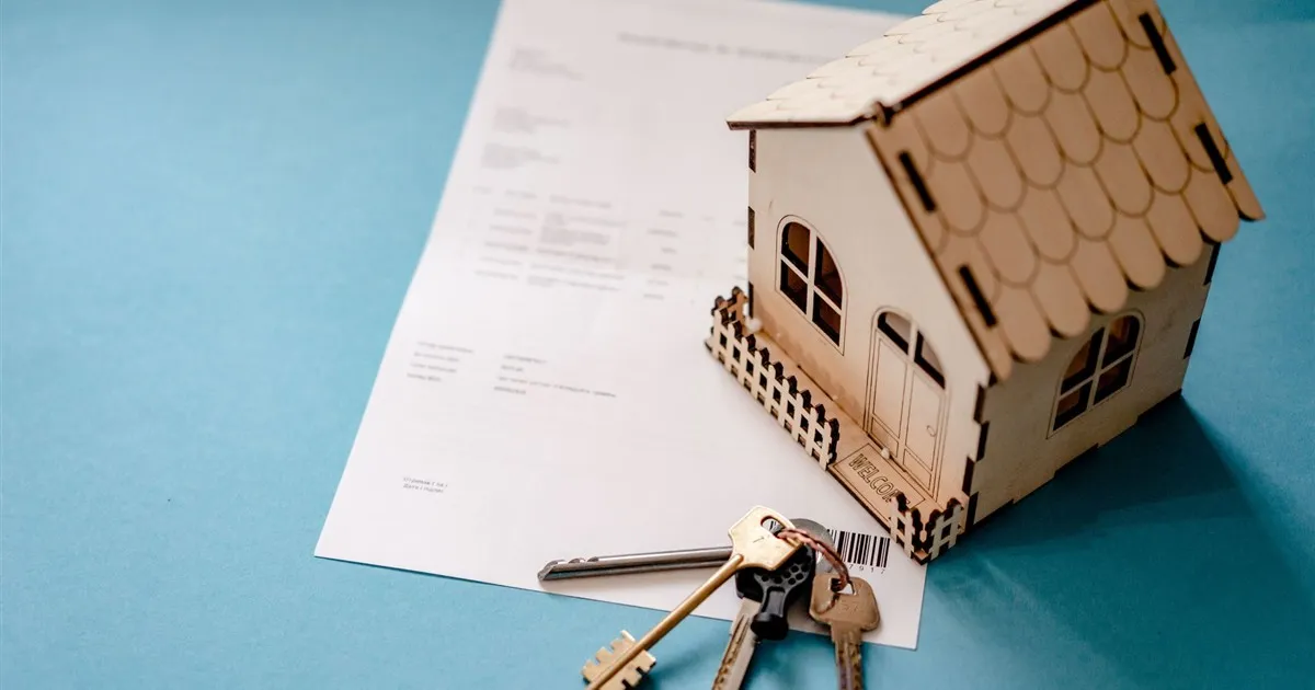 Car key on a vehicle title loan document in Canada