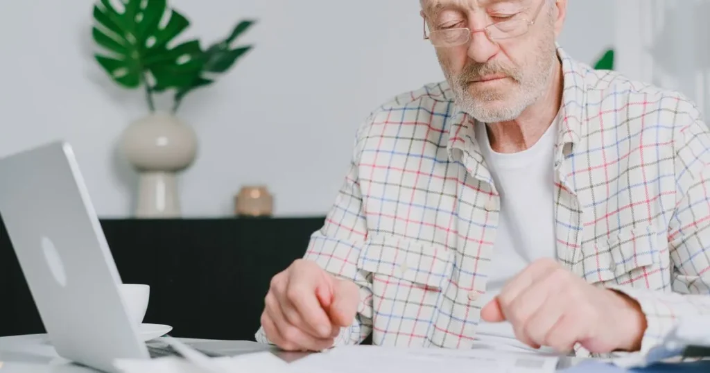 Man reviewing his budget before applying for a personal loan bad credit in Canada