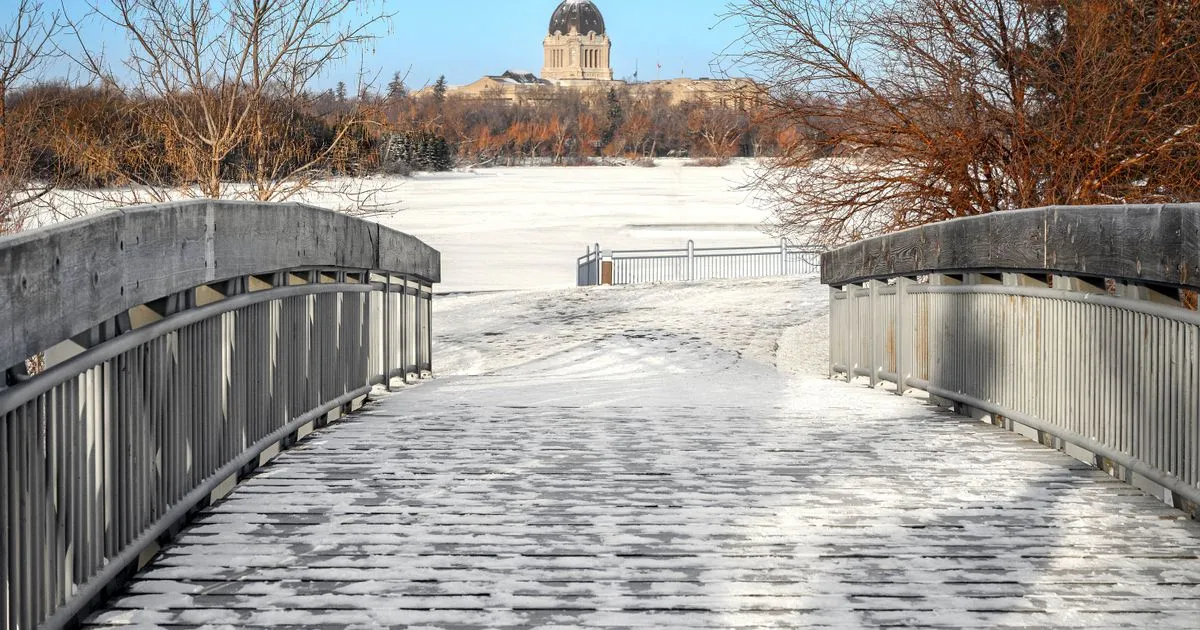 Borrowing in Regina - Saskatchewan Legislative Building across frozen Wascana Lake in winter