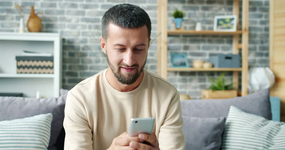 Lamina loans review - borrower checking short-term loan costs and terms on a phone