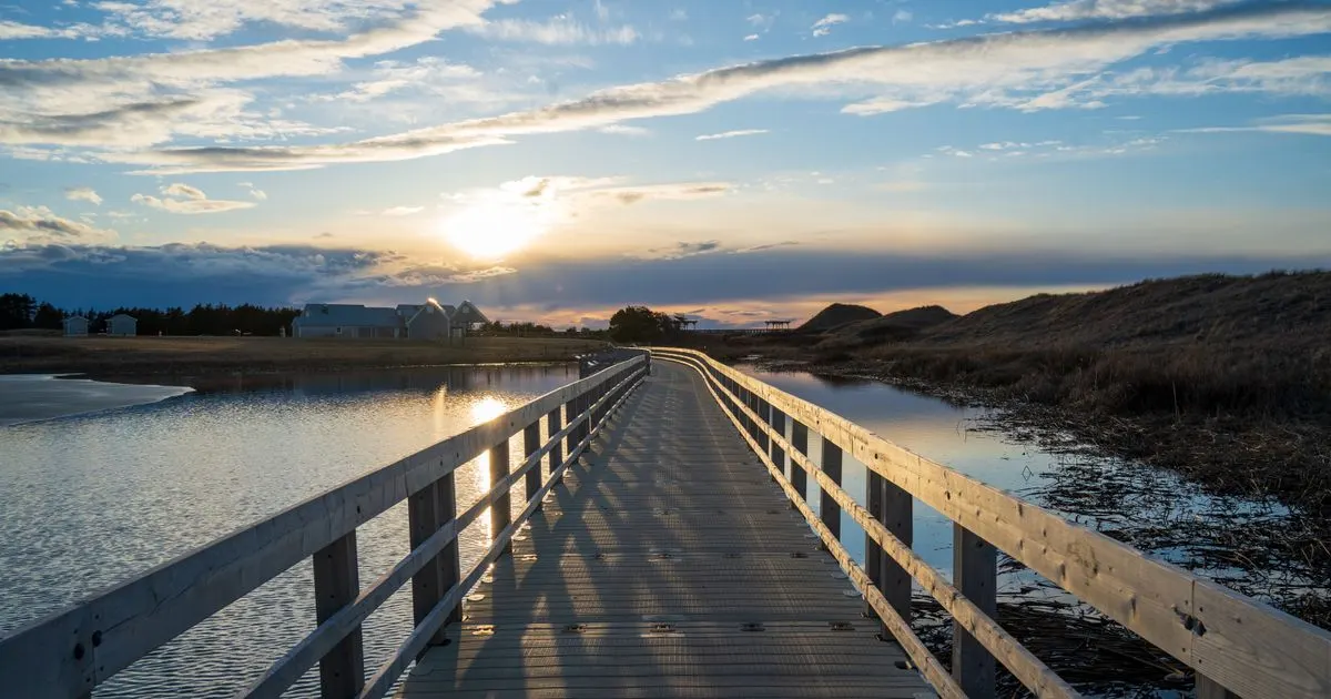 No credit check loans PEI - the Cavendish boardwalk at sunset on Prince Edward Island