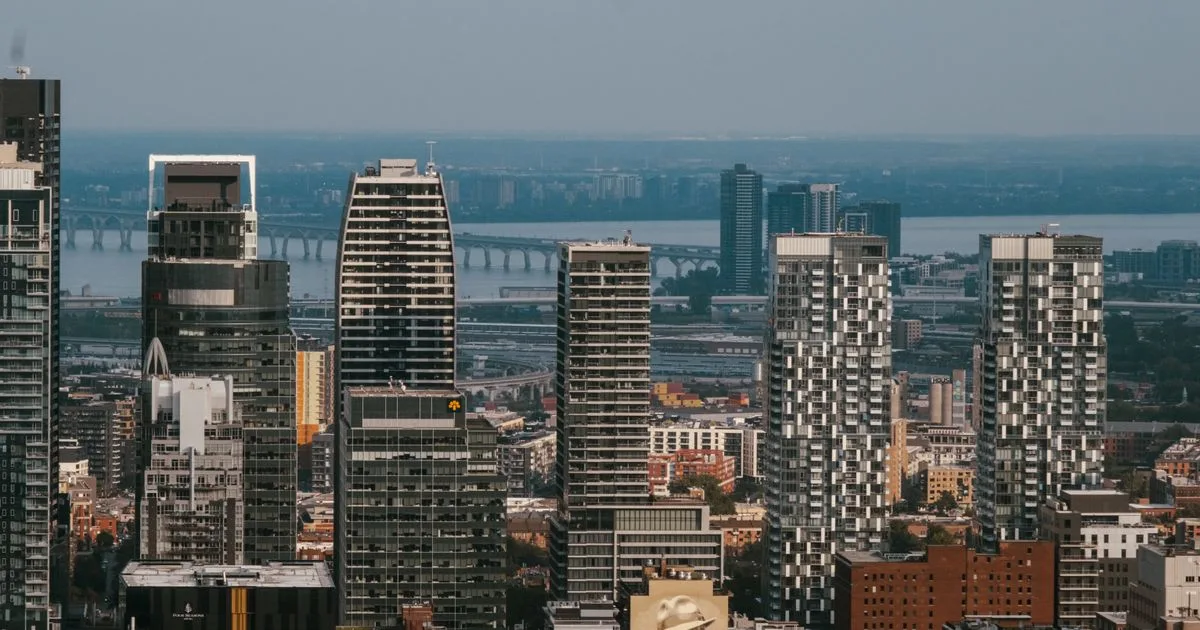 No credit check loans Quebec - downtown Montreal skyline with the Samuel De Champlain Bridge